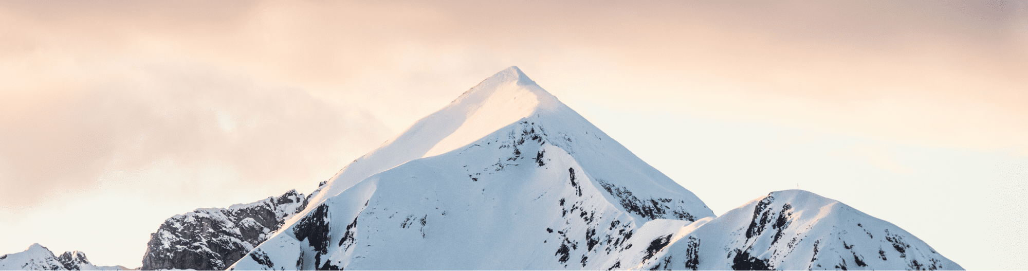 Mountains covered in snow in Obertauern in Salzburg. The mountains create a breathtaking backdrop for outdoor activities in the winter season. The snowy peaks offer a variety of slopes for skiing and snowboarding, attracting winter sports enthusiasts from around the world. The picturesque views of the snow-capped mountains against the clear blue sky create a tranquil and serene atmosphere, perfect for relaxation and adventure alike.